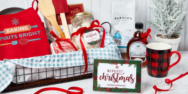 A basket lined with blue cloth filled with festive breakfast supplies beautifully customized with Avery tags, cards and transfers