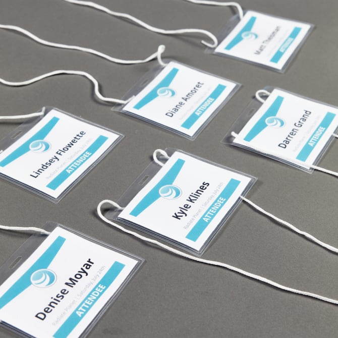 Graphic aqua meeting supplies template for customizing Avery 74459 horizontal hanging name badges.