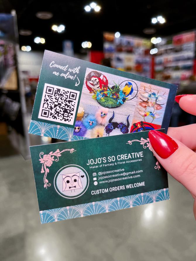 An example of Avery custom-printed business cards with a saturated color and full bleed. The design features images and a QR code for JoJo's So Creative.