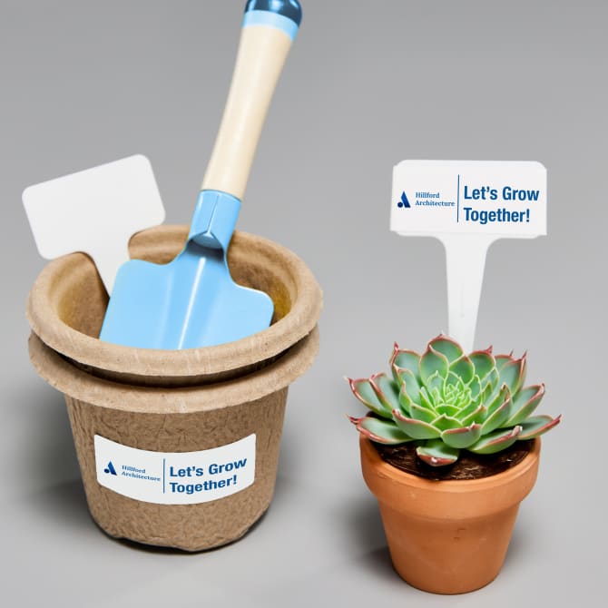 An eco-friendly swag bag idea of a plant and biodegradable pot labeled with Avery eco-friendly labels 48160.