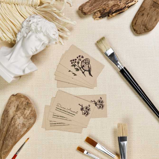 Image shows a stack of custom Avery business cards displayed on a light fabric surface, surrounded by paintbrushes and wooden decor, showcasing a creative business card design for farmers market vendors.