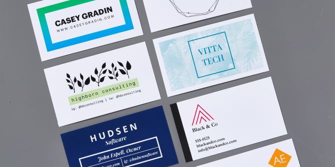 Avery printable business cards with Sure Feed(R) technology and the Avery Clean Edge(TM) feature. The cards with Sure Feed are shown coming out of a printer and the Clean Edge cards are broken apart demonstrating the smooth edge with no perforation bumps.