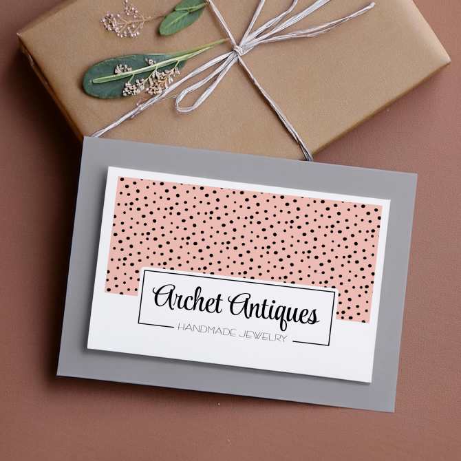 Image of a 4” x 6” postcard showcasing a chic design for a handmade jewelry business, featuring a pink polka dot pattern and elegant typography, created using an Avery postcard template.