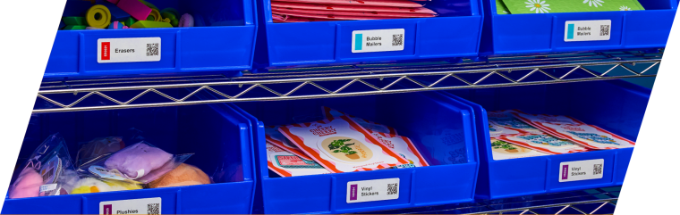 Rows of blue organization bins with color-coding labels filled with stickers and products