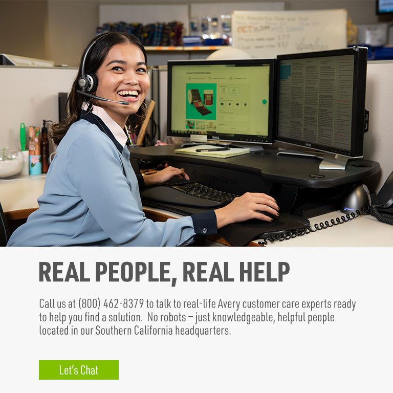 Real People, Real Help: Call us at (800) 462-8379 to talk to real-life Avery customer care experts ready to help you find a solution. No robots — just knowledgeable, helpful people located in our Southern California headquarters. | Avery Customer Care Center Representative smiling while on the phone at the computer.
