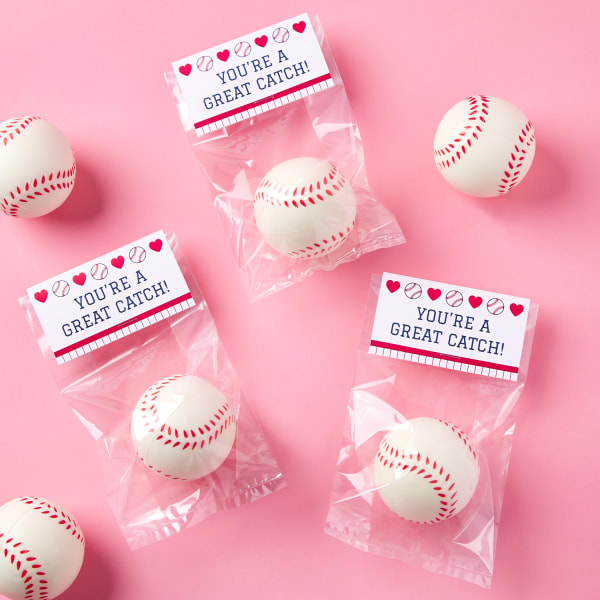 small baseballs in cellophane bags with small tent cards on top reading, 'you're a great catch'