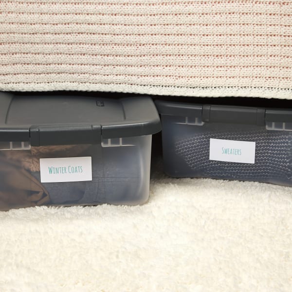 close up of winter clothing storage ideas using avery templates to label under bed storage containers