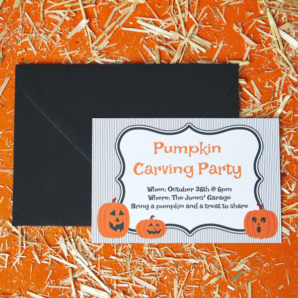 Festive pumpkin carving postcard invitation featuring a spooky Halloween design in a black envelope