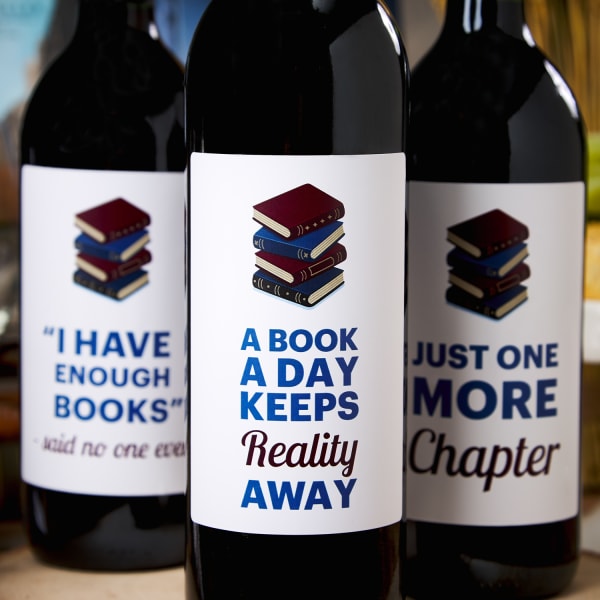 close up of wine bottle labels with book club theme on three wine bottles