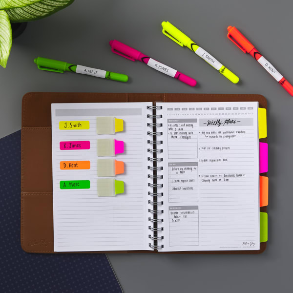 Neon highlighters with ultra tabs in a planner