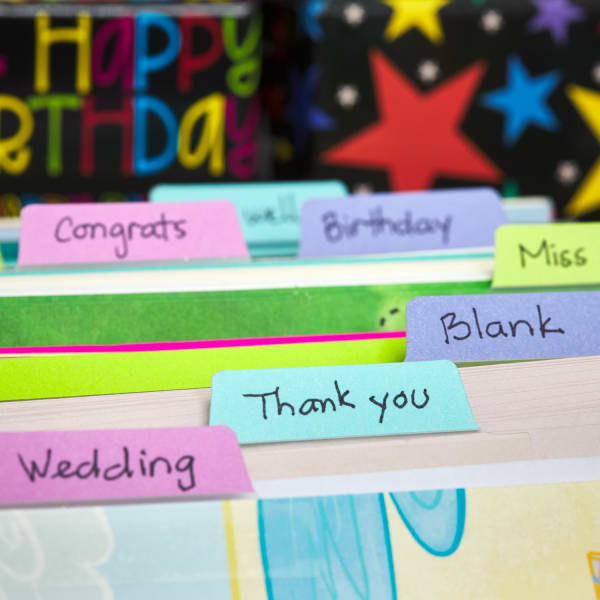 multiple colorful UltraTab index tabs on dividers filled with several varieties of greeting cards