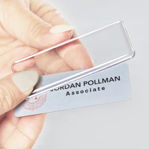 Insert name tag into plastic