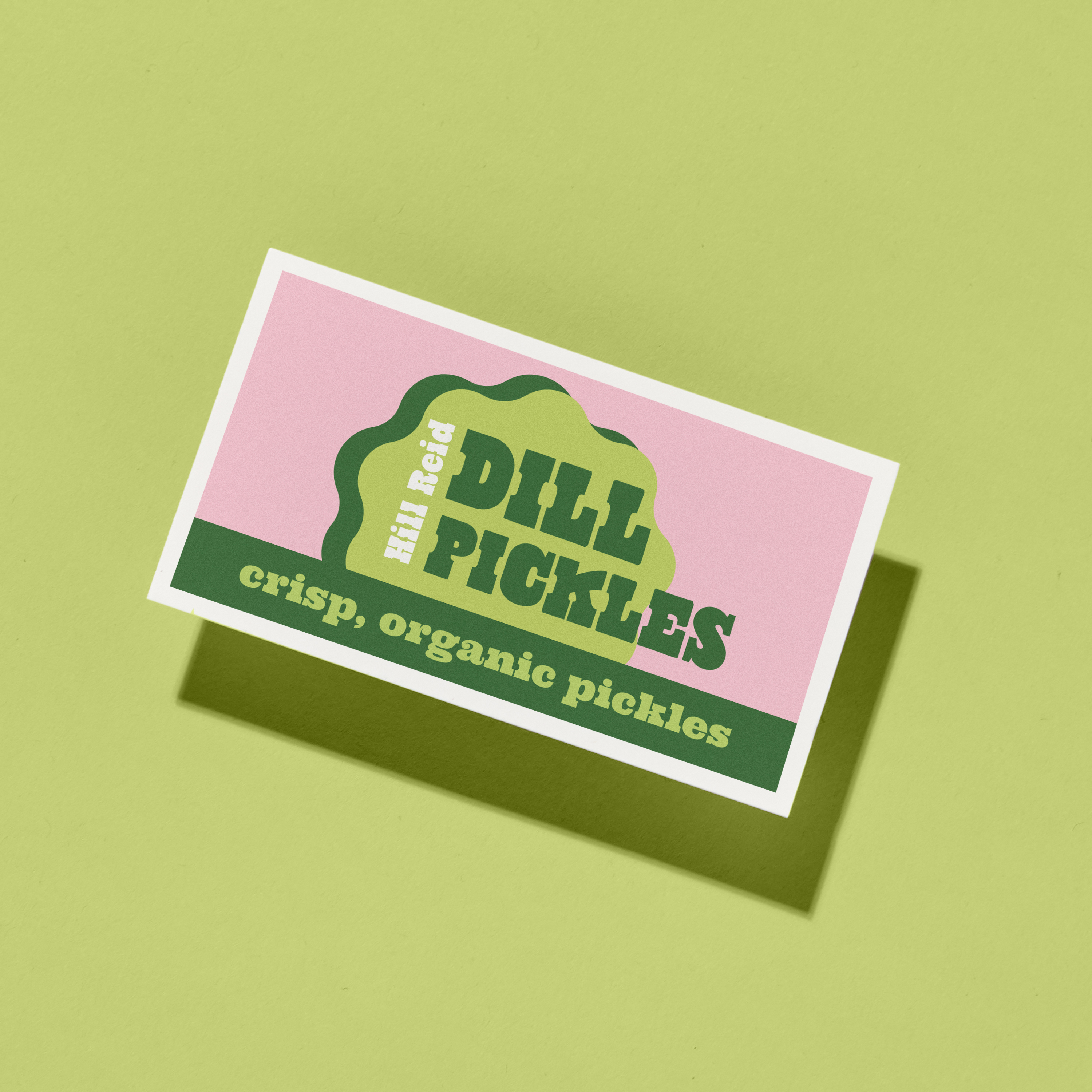 A playful business card for dill pickles shown against a pastel green background, styled as small business marketing tools for food and farmer’s market brands.