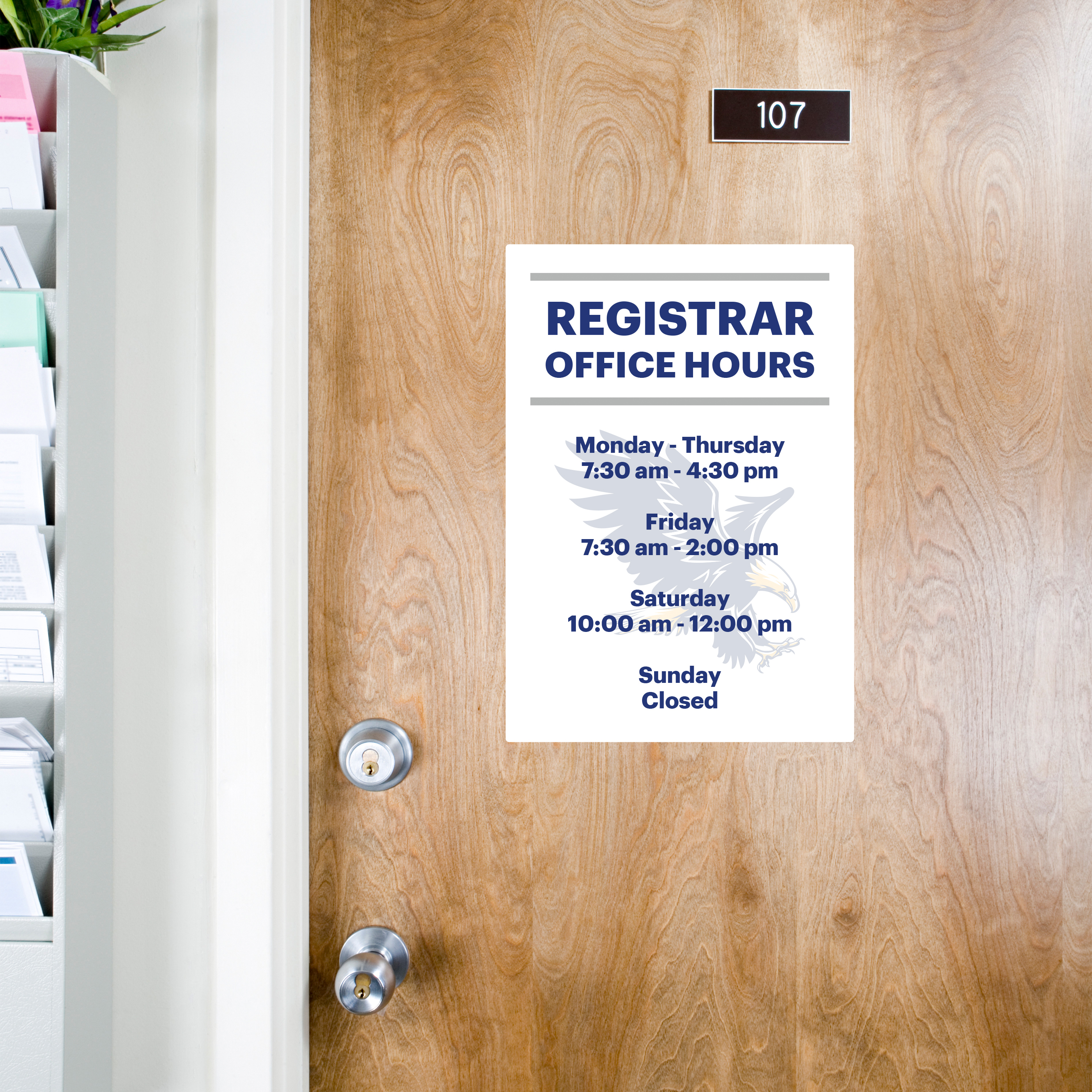 An example of an office hours sign printed on Avery 61515 removable signs for doors and walls. The sign reads "Registrar Office Hours" and lists days and times. The sign is applied on a wooden school office door. 