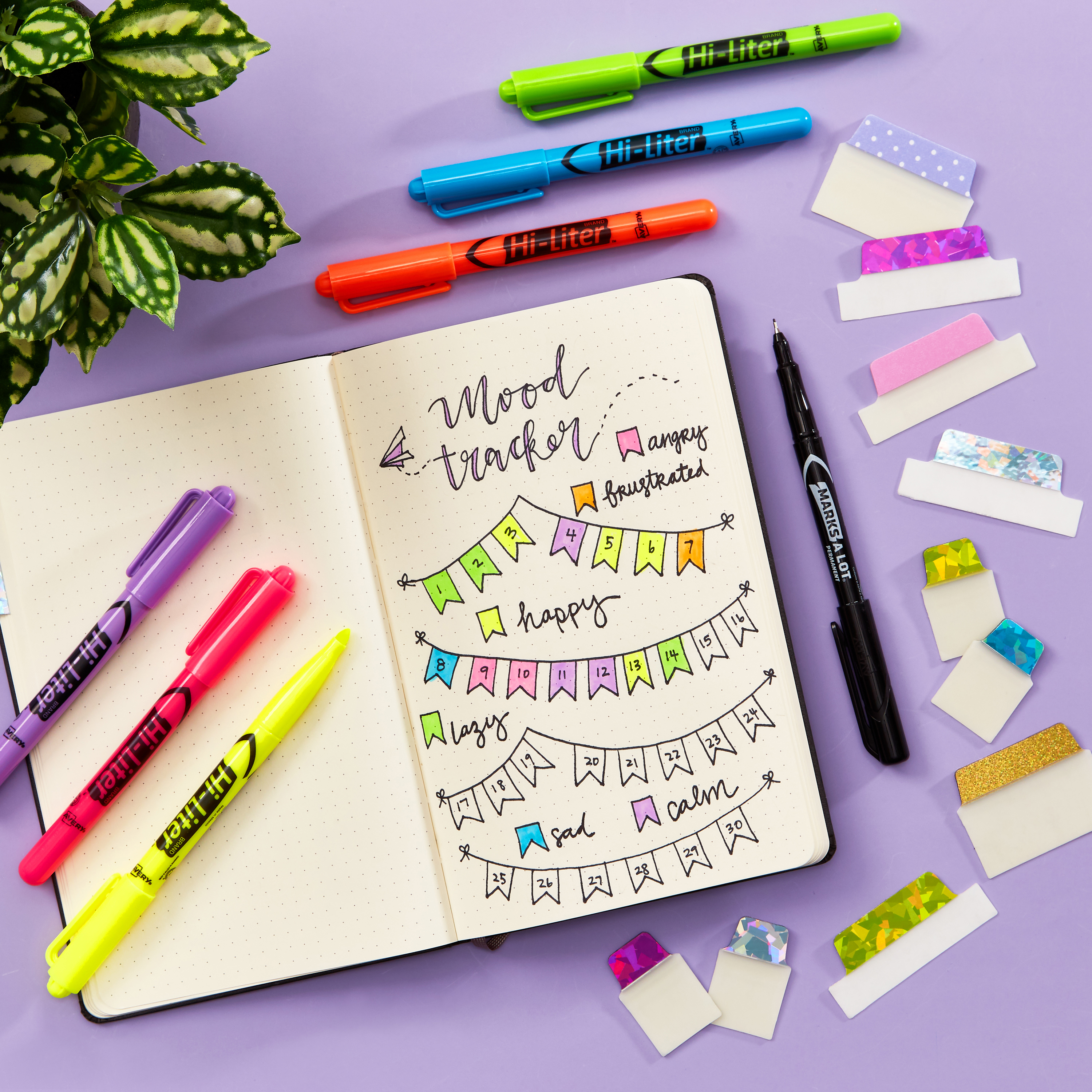 A top-down shot of index tabs for a back-to-school checklist. Avery 74147 Ultra Tabs are shown with a variety of other Ultra Tabs, highlighters and an open bullet journal. 