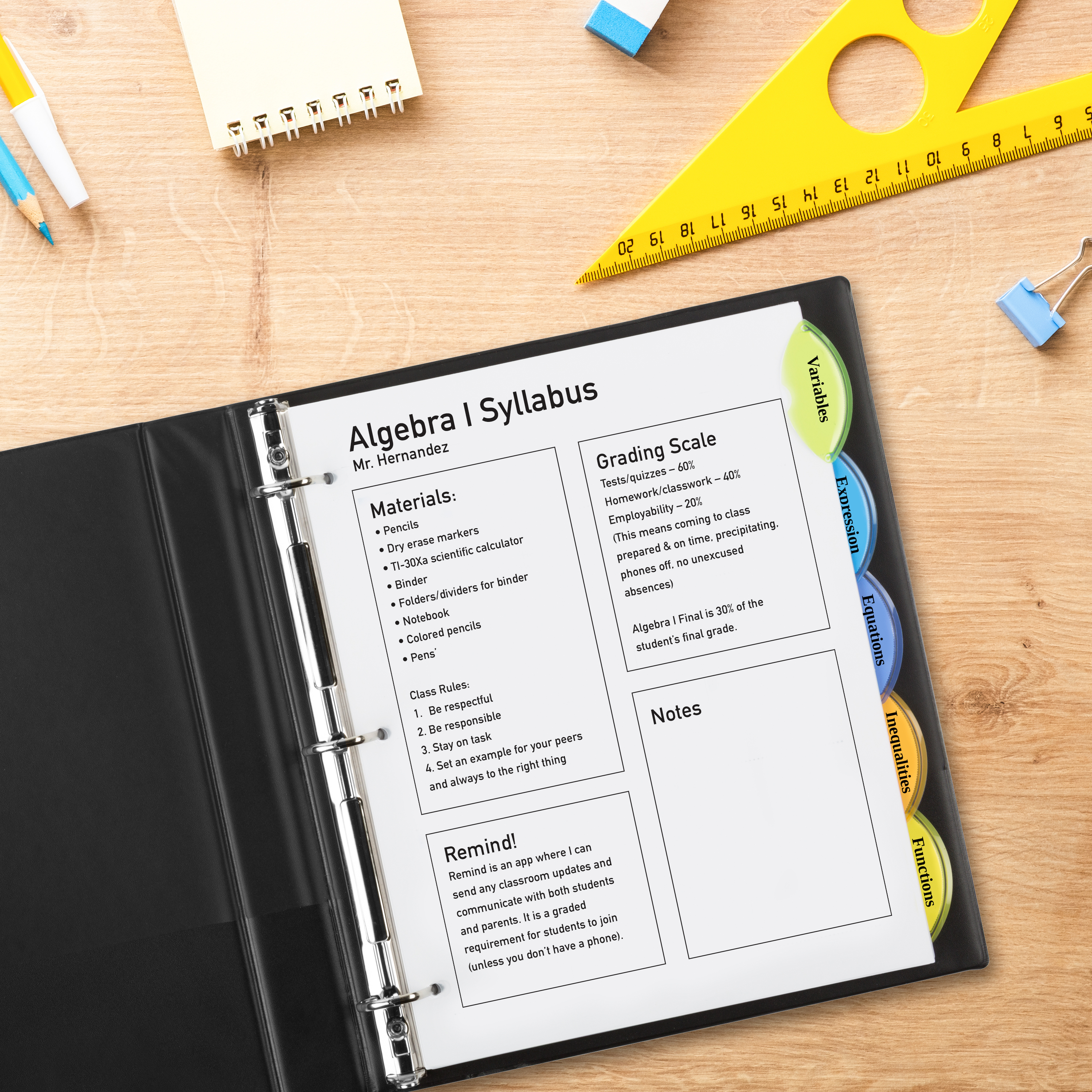 An Avery school binder is shown open on a wooden desk surrounded by a school supplies for math class. Inside the binder are Avery 11200 plastic big-tab dividers.