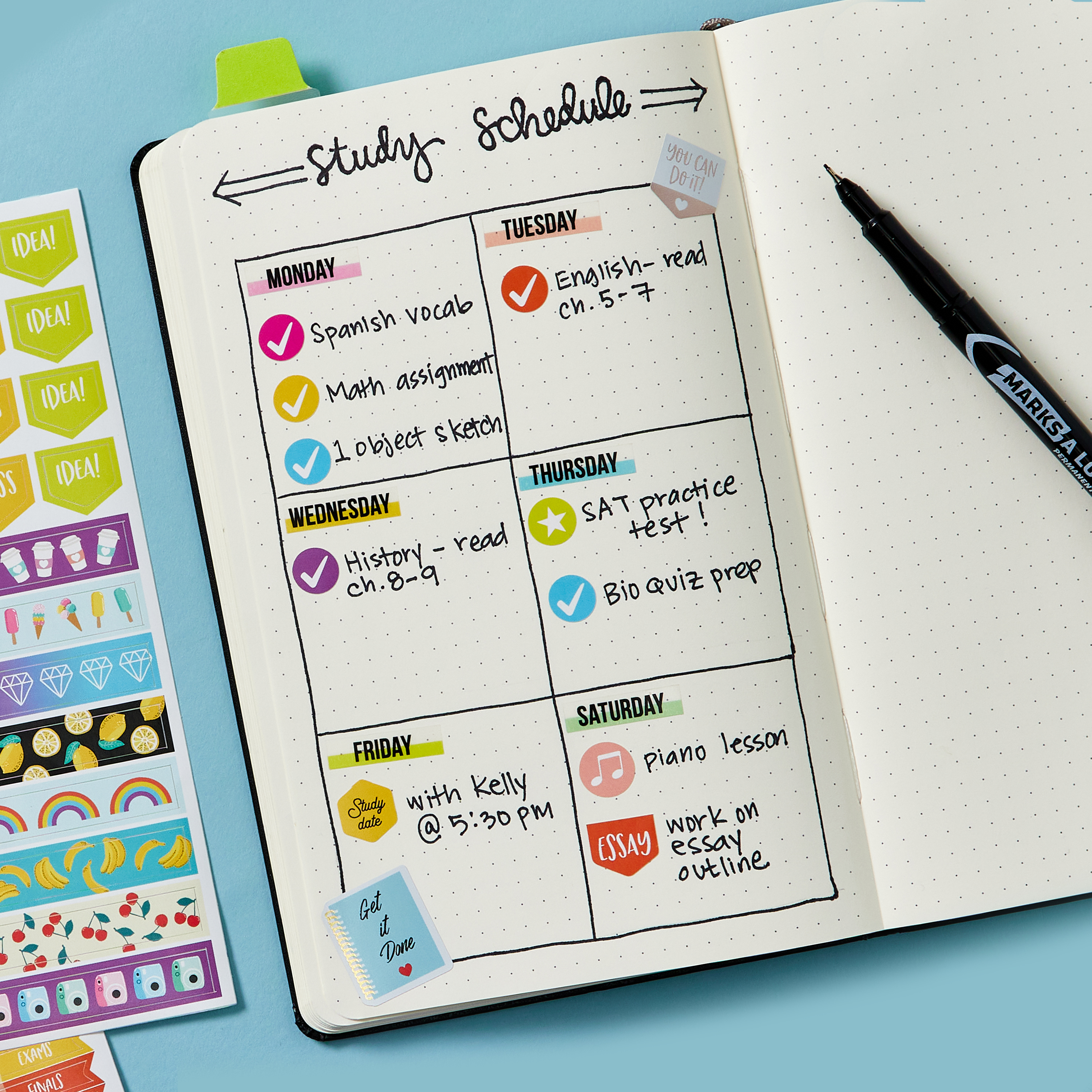 A top-down view of an open bullet journal planner for students. The open page shows an diagram of a study schedule and demonstrates the use of Avery Ultra Tabs and planner stickers.