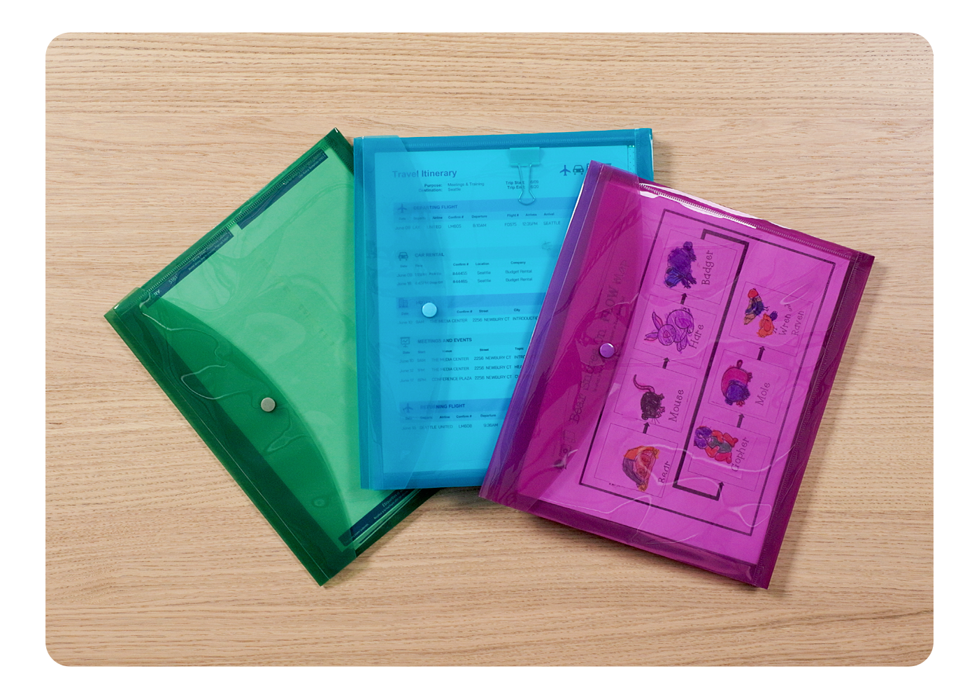 Two boxes labeled with round Avery labels printed with a green design