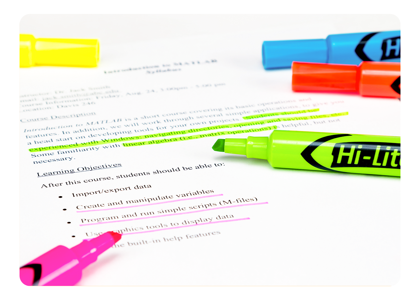 Avery highlighters in various colors and tip types on a sheet of white paper