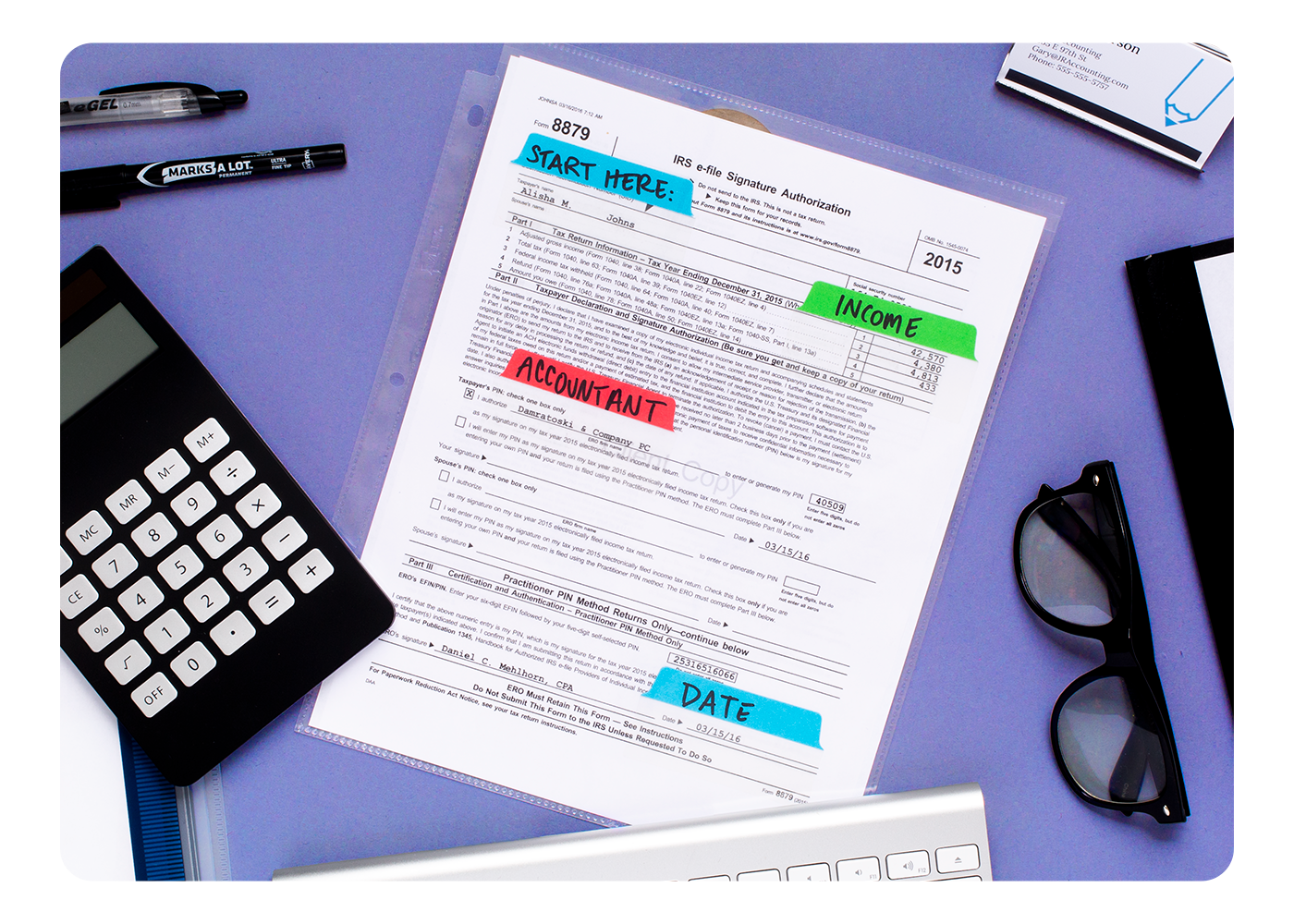 A tax document sleeved in an Avery sheet protector with Ultra Tabs used to mark areas for signatures, dates, and other information
